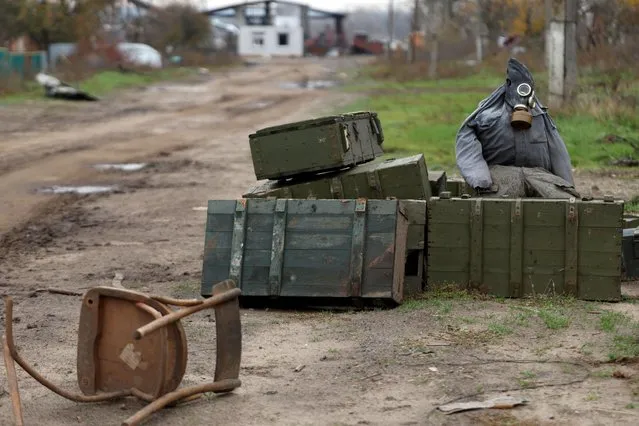 A former Russian checkpoint remains in a street in the village of Kamyanka, on the outskirts of Izium, Kharkiv region, Ukraine on November 3, 2022. The Hague-based International Commission on Missing Persons, an intergovernmental organization, estimates that more than 15,000 people have gone missing across Ukraine during the war, including detainees, those separated from their loved ones and people killed and buried in makeshift graves. (Photo by Clodagh Kilcoyne/Reuters)