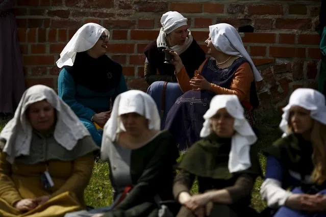 Participants talk as they attend the opening ceremony parade of the Medieval Combat World Championship at Malbork Castle, northern Poland, April 30, 2015. (Photo by Kacper Pempel/Reuters)