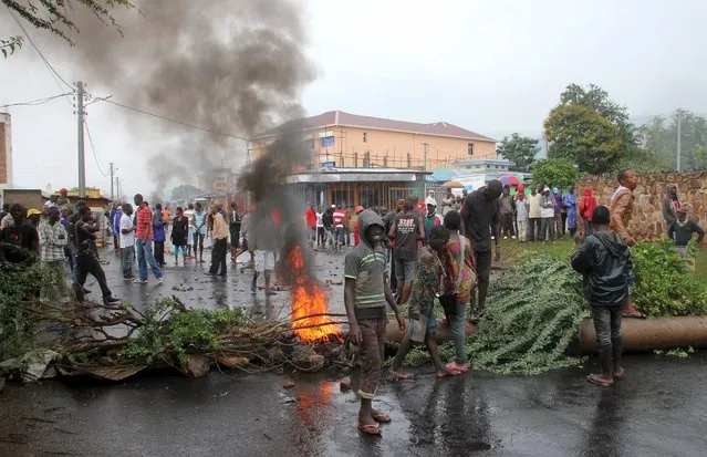 Protesters barricade a road as they demonstrate against plans by Burundian President Pierre Nkurunziza to run for a third five-year term in office, in Bujumbura, May 8, 2015. (Photo by Jean Pierre Aime Harerimana/Reuters)