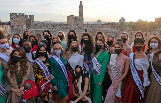 Contestants of the Miss Universe pageant visit the Tower of David Museum in the ancient citadel of Jerusalem near the Jaffa Gate entrance to Jerusalem's Old City, on November 30, 2021. (Photo by Menahem Kahana/AFP Photo)