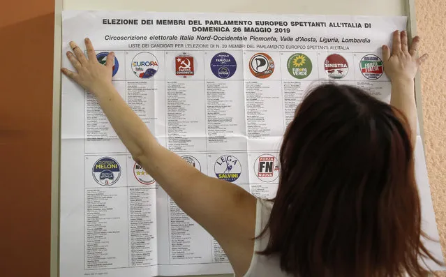 List of candidates are placed in a polling station ahead of Sunday's European Elections, in Rozzano, near Milan, Italy, Saturday, May 25, 2019. Some 400 million Europeans from 28 countries head to the polls from Thursday to Sunday to choose their representatives at the European Parliament for the next five years. (Photo by Antonio Calanni/AP Photo)