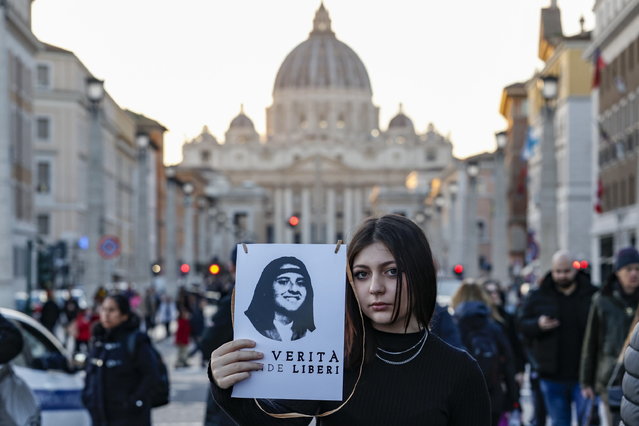 A woman holds a placard showing Emanuela Orlandi, a Vatican teenager who disappeared in 1983 aged 15, as she takes part in a rally along Via della Conciliazione near Vatican City, in Rome, Italy, 14 January 2023. Orlandi's disappearance is one of Italy's most notorious unsolved mysteries. The Vatican on 09 January 2023 reopened the investigation into Orlandi's disappearance. (Photo by Fabio Frustaci/EPA/EFE)