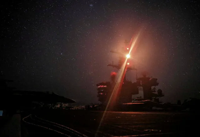 The U.S. Navy Nimitz-class aircraft carrier USS Abraham Lincoln transits the U.S. 5th Fleet area of operations in the Arabian Sea in this May 26, 2019 handout photo. Picture taken May 26, 2019. (Photo by Mass Communication Specialist 3rd Class Jeremiah Bartelt/U.S. Navy/Handout via Reuters)