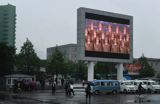 A large screen monitor with patriotic messages  in Pyongyang, North Korea on May 6, 2016. (Photo by Linda Davidson/The Washington Post)