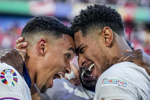 England's Jude Bellingham, right, and England's Trent Alexander-Arnold celebrate after a quarterfinal match between England and Switzerland at the Euro 2024 soccer tournament in Duesseldorf, Germany, Saturday, July 6, 2024. (Photo by Darko Vojinovic/AP Photo)