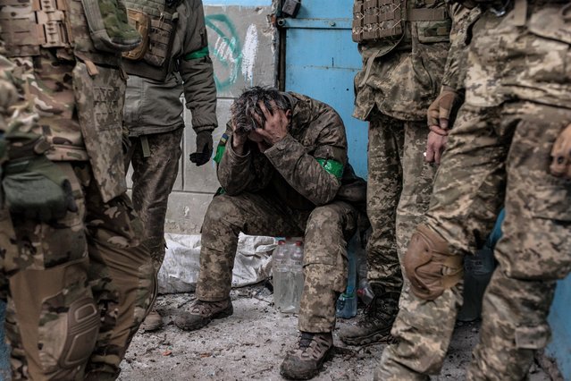 Ukrainian soldier with contusions waits to be transferred to hospital in the direction of Bakhmut frontline as intense military mobility continues amid Russia-Ukraine war on April 11, 2023. (Photo by Diego Herrera Carcedo/Anadolu Agency via Getty Images)