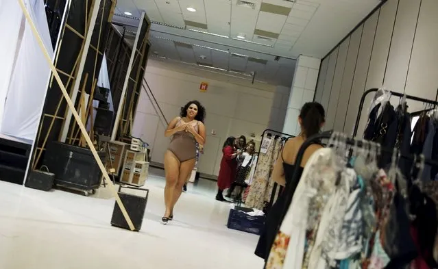 A model runs backstage before a presentation as part of Fashion Weekend Plus Size Summer 2015 collection show in Sao Paulo, July 25, 2015. (Photo by Nacho Doce/Reuters)