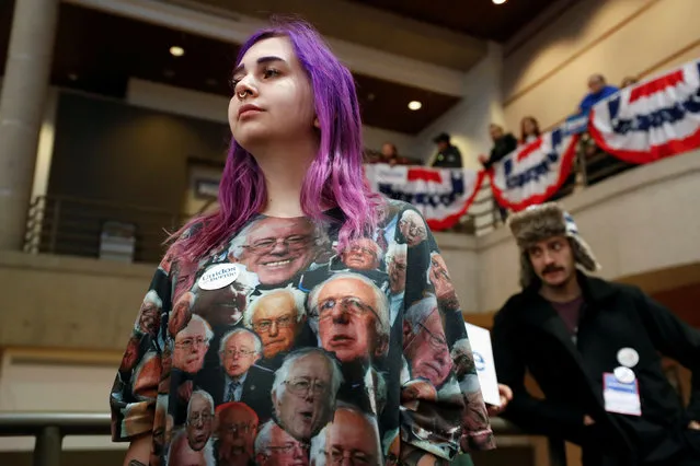 A supporter of Democratic 2020 U.S. presidential candidate and U.S. Senator Bernie Sanders stands during a campaign event in Des Moines, Iowa, U.S., January 20, 2020. (Photo by Shannon Stapleton/Reuters)