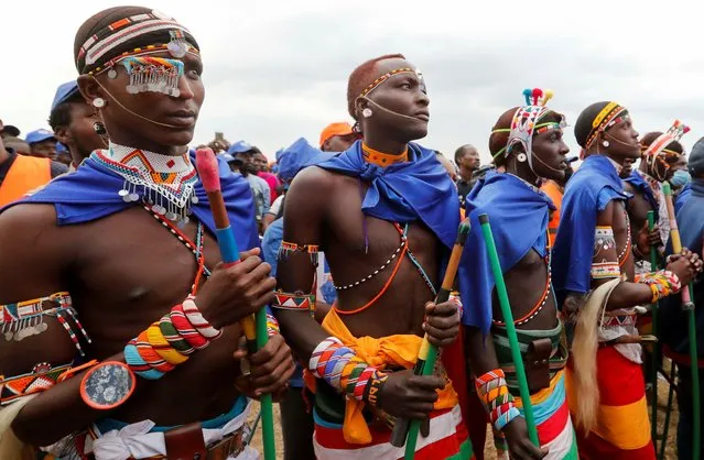 Maasai supporters of Kenya's opposition leader and presidential candidate Raila Odinga of the Azimio la Umoja (Declaration of Unity) party, wearing traditional clothes, attend a campaign rally ahead of the forthcoming general election in the Rift Valley town of Suswa, Narok county, Kenya on July 30, 2022. (Photo by Thomas Mukoya/Reuters)