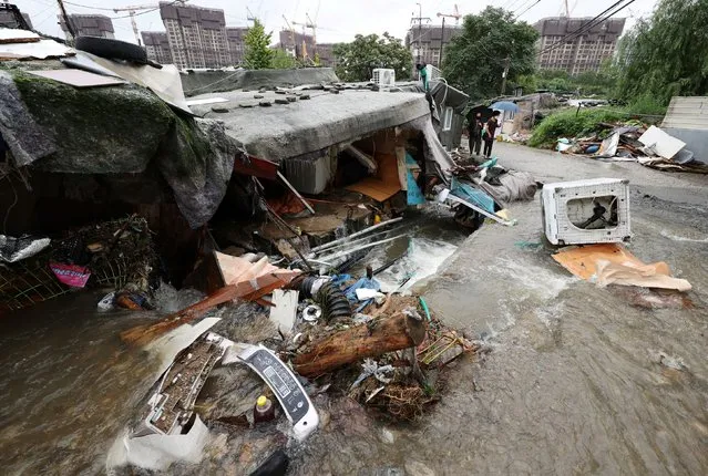 A shack damaged by torrential rain of the previous day is seen at a shanty area in Seoul, South Korea on August 9, 2022. (Photo by Yonhap via Reuters)