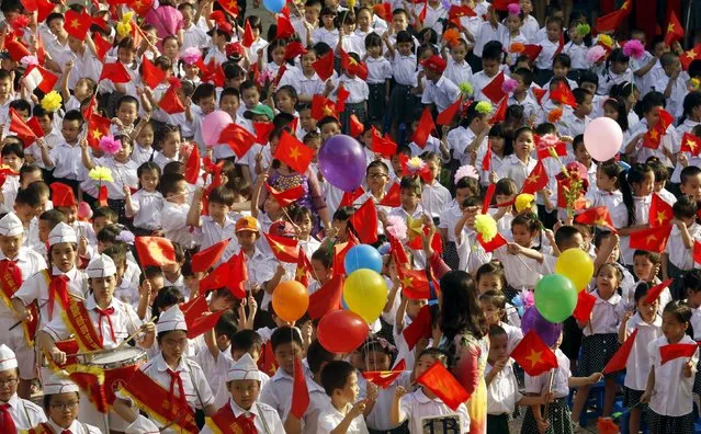 Children attend the opening ceremony of the new school year at a school in Hanoi September 5, 2015. (Photo by Reuters/Kham)