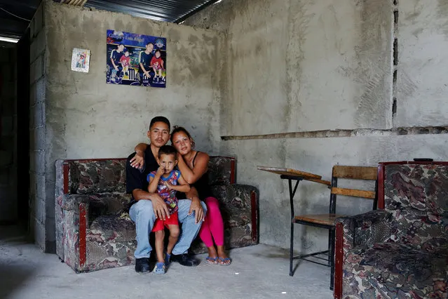 Oleydy Canizalez, 29, poses for a picture with her husband Julio Espinoza, 28, and her son Luis, 3, before her sterilization surgery, at their home in Charallave, Venezuela July 7, 2016. (Photo by Carlos Garcia Rawlins/Reuters)