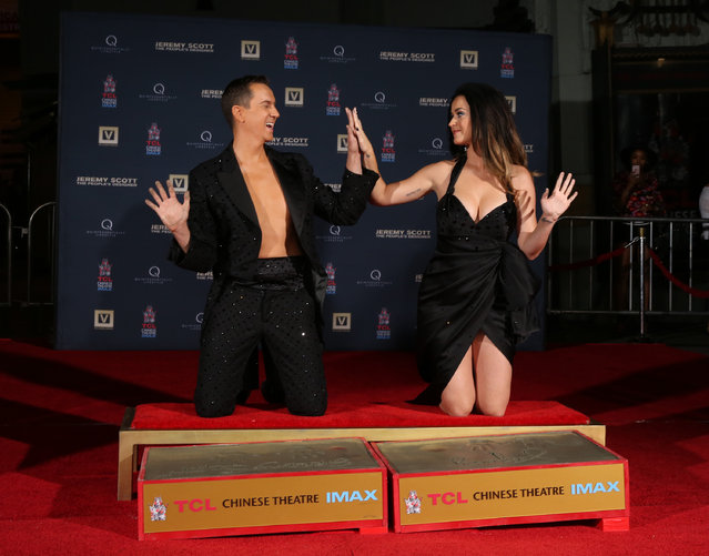 Jeremy Scott, left, and Katy Perry participate in the hand print ceremony at the World Premiere of JEREMY SCOTT: THE PEOPLE'S DESIGNER, presented by The Vladar Company and Quintessentially at the TCL Chinese Theatre on Tuesday, September 8, 2015, in Hollywood, Calif. (Photo by Matt Sayles/Invision for The Vladar Company/AP Images)