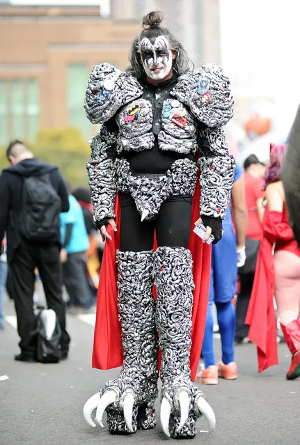 A Comic Con attendee poses as a Kiss member during the 2014 New York Comic Con at Jacob Javitz Center on October 10, 2014 in New York City. (Photo by Daniel Zuchnik/Getty Images)