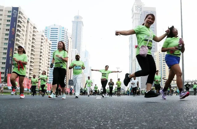 Participants taking part in the 10 km and 5 km Dubai Run 2022 on Sheikh Zayed road in Dubai on November 20, 2022. (Photo by Pawan Singh/The National)
