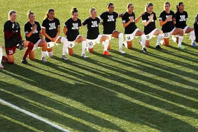 Members of the OL Reign kneel for the national anthem before the quarterfinal match of the NWSL Challenge Cup at Zions Bank Stadium on July 18, 2020 in Herriman, Utah. (Photo by Maddie Meyer/Getty Images)