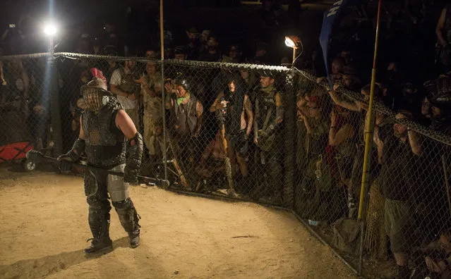 Enthusiasts watch a fight in the gladiator arena during Wasteland Weekend event in California City, California September 26, 2015. (Photo by Mario Anzuoni/Reuters)