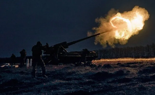 Ukrainian soldiers fire a Pion artillery system at Russian positions near Bakhmut, Donetsk region, Ukraine, Thursday, December 15, 2022. (Photo by LIBKOS/AP Photo)
