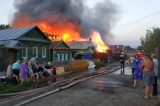 The site of a massive fire in Zheleznodorozhny District of Samara, Russia on August 8, 2020. The fire hit 10 residential houses. (Photo by Russian Emergencies Ministry/TASS via Getty Images)
