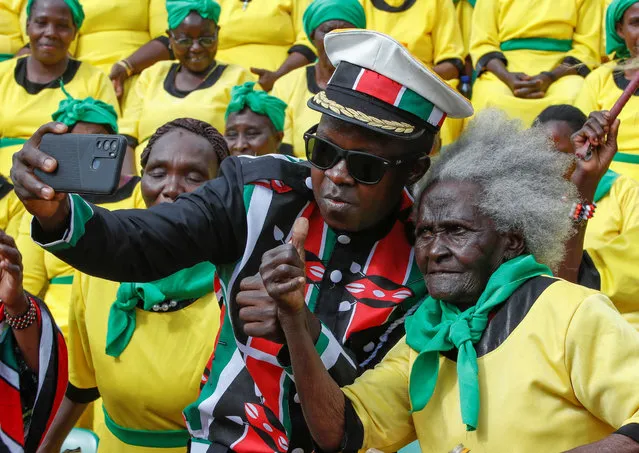 Entertainers take a selfie during the Kenya's 59th Jamhuri Day or Independence Day celebrations at the Nyayo National Stadium in Nairobi Kenya on December 12, 2022. (Photo by Monicah Mwangi/Reuters)