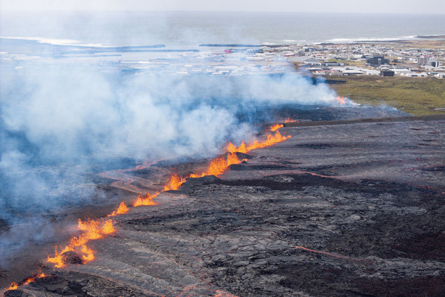 Molten lava is seen coming out of a fissure on the outskirts of the fishing village Grindavik in southwest Iceland, on April 1, 2025. The Icelandic Meteorological Office (IMO) said “an eruption has started on the Sundhnuksgigar Crater Row” north of the fishing village Grindavik that was evacuated Tuesday after lava began spewing from a volcanic eruption, the eighth to hit the region since the end of 2023. (Photo by Ael Kermarec/AFP Photo)