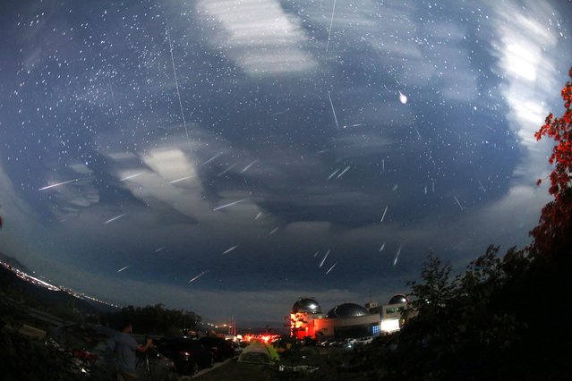 The Perseid meteor shower is decorating the night sky at the Cho Kyung-cheol Astronomical Observatory in Hwacheon, Gangwon Province, on the morning of August 13, 2017. This is not a photo of the meteor shower falling all at once, but rather a composite of 50 long exposure photos. (Photo by Nam Kang-ho)