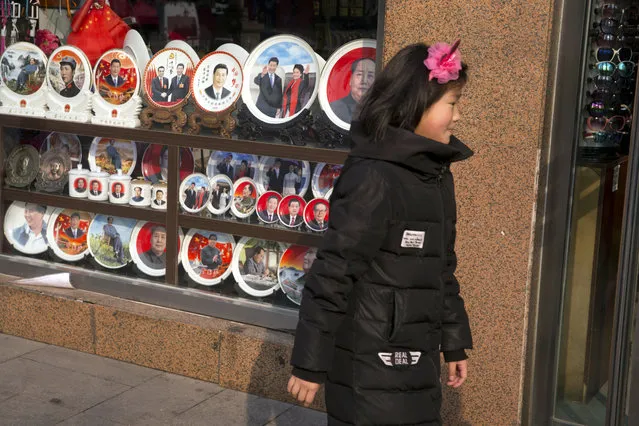 Memorabilia featuring Chinese President Xi Jinping and former paramount leader Mao Zedong are displayed at a souvenir shop in Beijing, Monday, February 26, 2018. Chinese censors moved quickly Monday to scrub satirical commentary online about the ruling Communist Party's moves to enable Xi to stay in power indefinitely, while political observers weighed the possibility that China would return to an era of one-man rule. (Photo by Ng Han Guan/AP Photo)