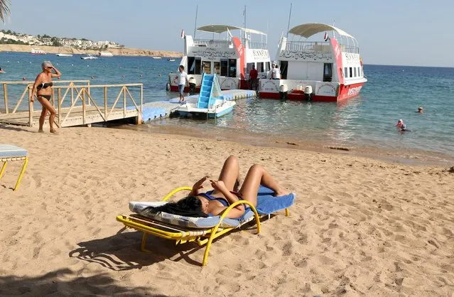 A tourist sunbaths by the beach in the Red Sea resort of Sharm el-Sheikh, November 7, 2015. (Photo by Asmaa Waguih/Reuters)