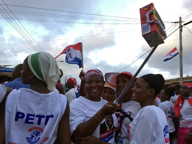 Supporters of Ghana opposition leader Nana Akufo-Addo wave boxes of Kalyppo juice in Accra, Ghana October 11, 2016. (Photo by Matthew Mpoke Bigg/Reuters)