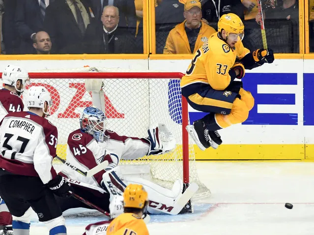 Nashville Predators left wing Viktor Arvidsson (33) makes a jump screen as Colorado Avalanche goalie Jonathan Bernier (45) makes a save during the third period in game two of the first round of the 2018 Stanley Cup Playoffs at Bridgestone Arena in Nashville, TN, USA on April 14, 2018. (Photo by Christopher Hanewinckel/Reuters/USA TODAY Sports)