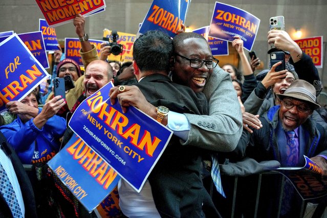 Democratic candidate Zohran Mamdani, left center, is embraced by a supporter upon arriving to participate in a mayoral debate in New York, October 16, 2025. (Photo by Angelina Katsanis/AP Photo)