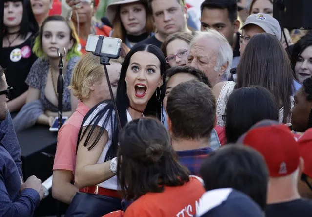 Singer Katy Perry reacts for a selfie at a rally in support of Democratic presidential nominee Hillary Clinton, Saturday, October 22, 2016, in Las Vegas. (Photo by John Locher/AP Photo)