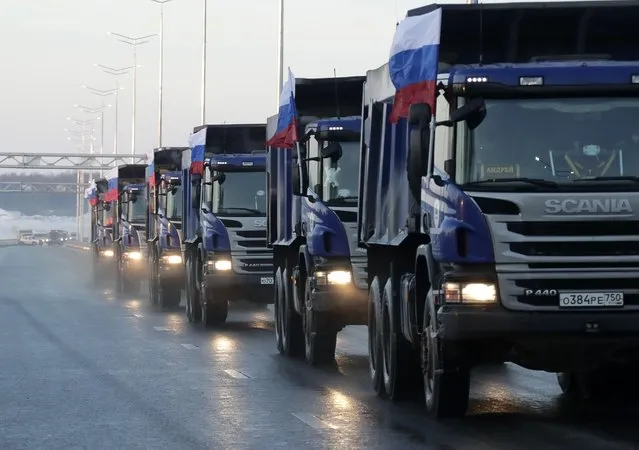 Trucks drive along the main route of the TsKAD Central Ring Road during its launch in Moscow, Russia, on December 28, 2020. (Photo by Mikhail Metzel/TASS)