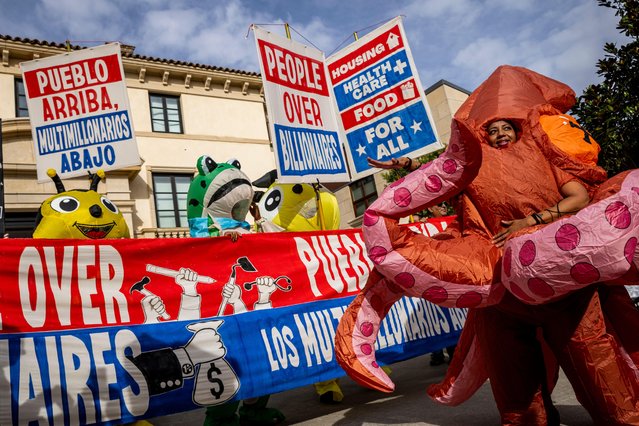 Protesters march in the People Over Billionaires protest in the Pacific Heights neighborhood of San Francisco, Saturday, November 15, 2025. (Photo by Stephen Lam/San Francisco Chronicle via AP Photo)