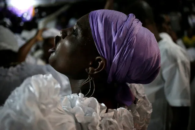 A voodoo believer reacts as she dances during a ceremony of Fet Gede in a Peristil, a voodoo temple, in Port-au-Prince, Haiti, November 1, 2016. (Photo by Andres Martinez Casares/Reuters)