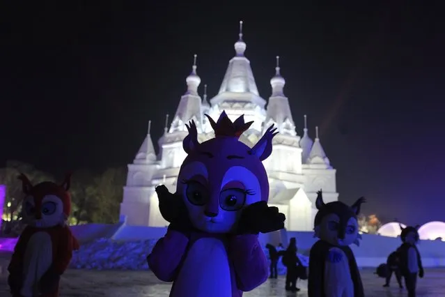 People dress up in animal costumes at the Harbin International Ice and Snow Sculpture Festival, January 1, 2016, in Harbin, China. (Photo by Tao Zhang/NurPhoto/Sipa USA/AP Photo)