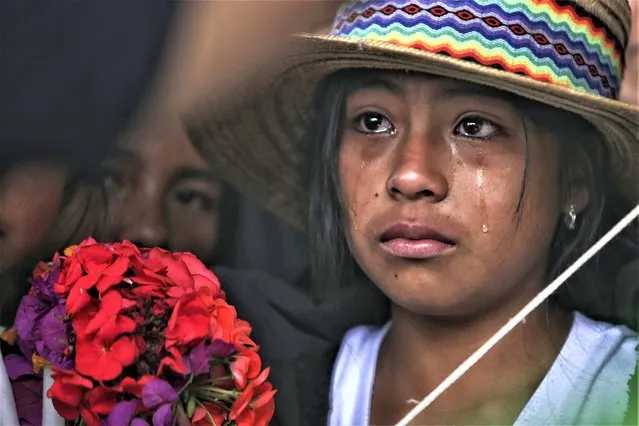 A mourner cries during the wake of Indigenous regional leader Fredy Campo Bomba, in Caldono, Colombia, Saturday, July 29, 2023. Campo Bomba was killed by unidentified gunmen on July 26. (Photo by Andres Quintero/AP Photo)