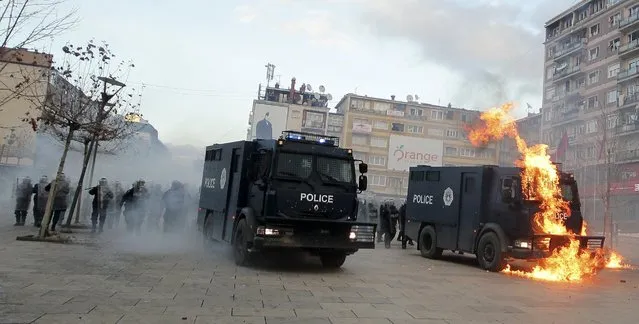 A police vehicle is set on fire by protesters during clashes in Pristina, Kosovo January 9, 2016. (Photo by Agron Beqiri/Reuters)