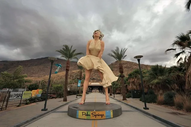 The “Forever Marilyn” statue, designed by US artist John Seward Johnson II, is framed by storm clouds as Hurricane Hilary heads north toward southern California, in Palm Springs, California, on August 19, 2023. Hilary brought heavy rains on August 19 to portions of Mexico's Baja California peninsula and the southwestern United States, as officials warned the powerful hurricane was likely to cause “catastrophic and life-threatening” flooding. (Photo by David Swanson/AFP Photo)