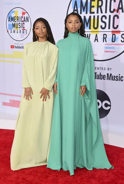 Halle Bailey, left, and Chloe Bailey, of Chloe x Halle, arrive at the American Music Awards on Tuesday, October 9, 2018, at the Microsoft Theater in Los Angeles. (Photo by Jordan Strauss/Invision/AP Photo)