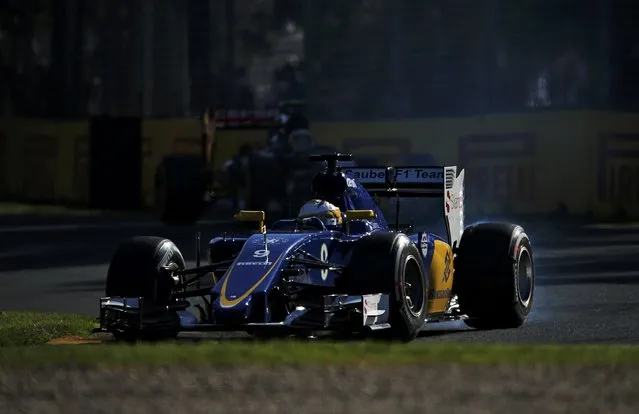Smoke comes out of the car of Sauber Formula One driver Marcus Ericsson of Sweden during the second practice session of the Australian F1 Grand Prix at the Albert Park circuit in Melbourne March 13, 2015.  REUTERS/Jason Reed