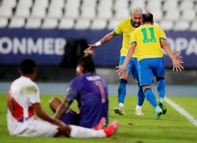 Brazil's Everton Ribeiro celebrates scoring their third goal with Neymar against Peru in the Copa America match in Rio de Janeiro, Brazil, June 17, 2021. (Photo by Ricardo Moraes/Reuters)