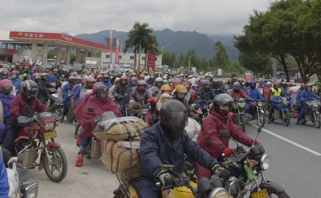 Motorcyclists ride on a highway as they head back to their hometowns ahead of the upcoming Spring Festival from Zhaoqing, Guangdong province, February 2, 2016. (Photo by Reuters/Stringer)