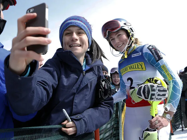 Maria Cavallaro, 14, of North Andover, Mass., snaps a selfie with Mikaela Shiffrin after the skier won the women's slalom ski race at the U.S. Alpine Championships, Saturday, March 28, 2015, at Sugarloaf Mountain Resort in Carrabassett Valley, Maine. (Photo by Robert F. Bukaty/AP Photo)