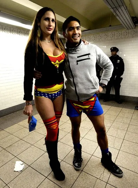 Two riders in the New York City subway in the underwear as they take part in the 2014 No Pants Subway Ride January 12, 2014. (Photo by Timothy A. Clary/AFP Photo)