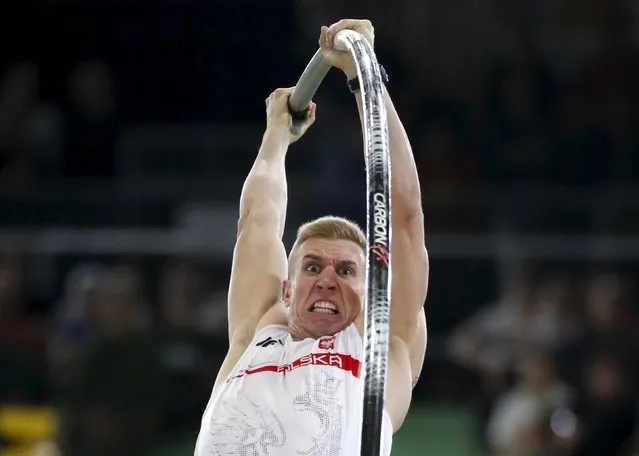 Piotr Lisek of Poland competes in the men's pole vault event during the IAAF World Indoor Athletics Championships in Portland, Oregon March 17, 2016. (Photo by Lucy Nicholson/Reuters)