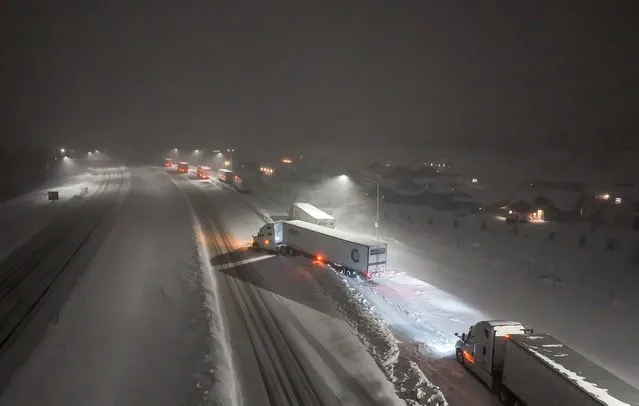 Trucks parked on Highway I-80 due to no visibility, near California border in Reno, Nevada, United States on March 3, 2024 as blizzard warning issued for California's Sierra Nevada. (Photo by Tayfun Coskun/Anadolu via Getty Images)
