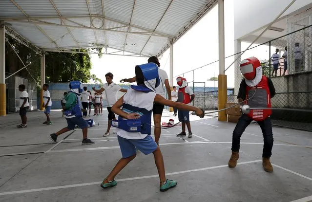 Children from municipal school Parana take part in the project “Fencing School” in Rio de Janeiro, Brazil, March 30, 2016. (Photo by Sergio Moraes/Reuters)