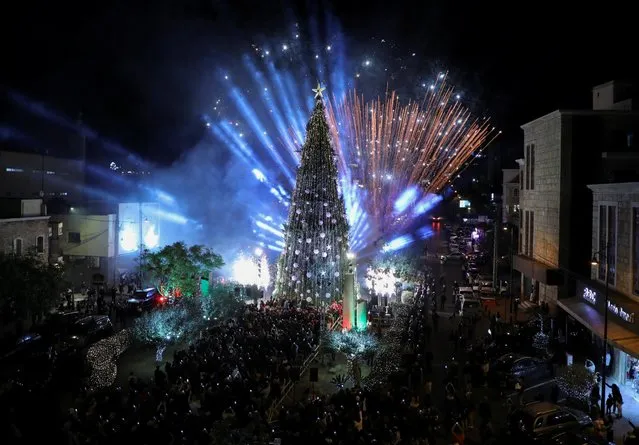 Fireworks explode during a Christmas tree lighting ceremony in Byblos, Lebanon on December 7, 2021. (Photo by Mohamed Azakir/Reuters)