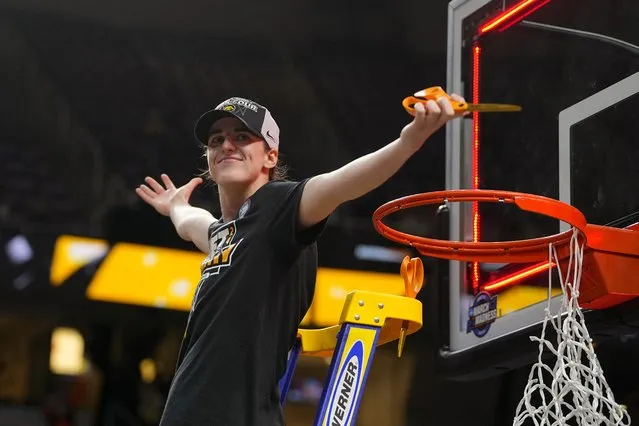 Iowa Hawkeyes guard Caitlin Clark cuts the net after defeating the LSU Lady Tigers to reach the Final Four, in Albany, New York on April 2, 2024. (Photo by Gregory Fisher/USA TODAY Sports)